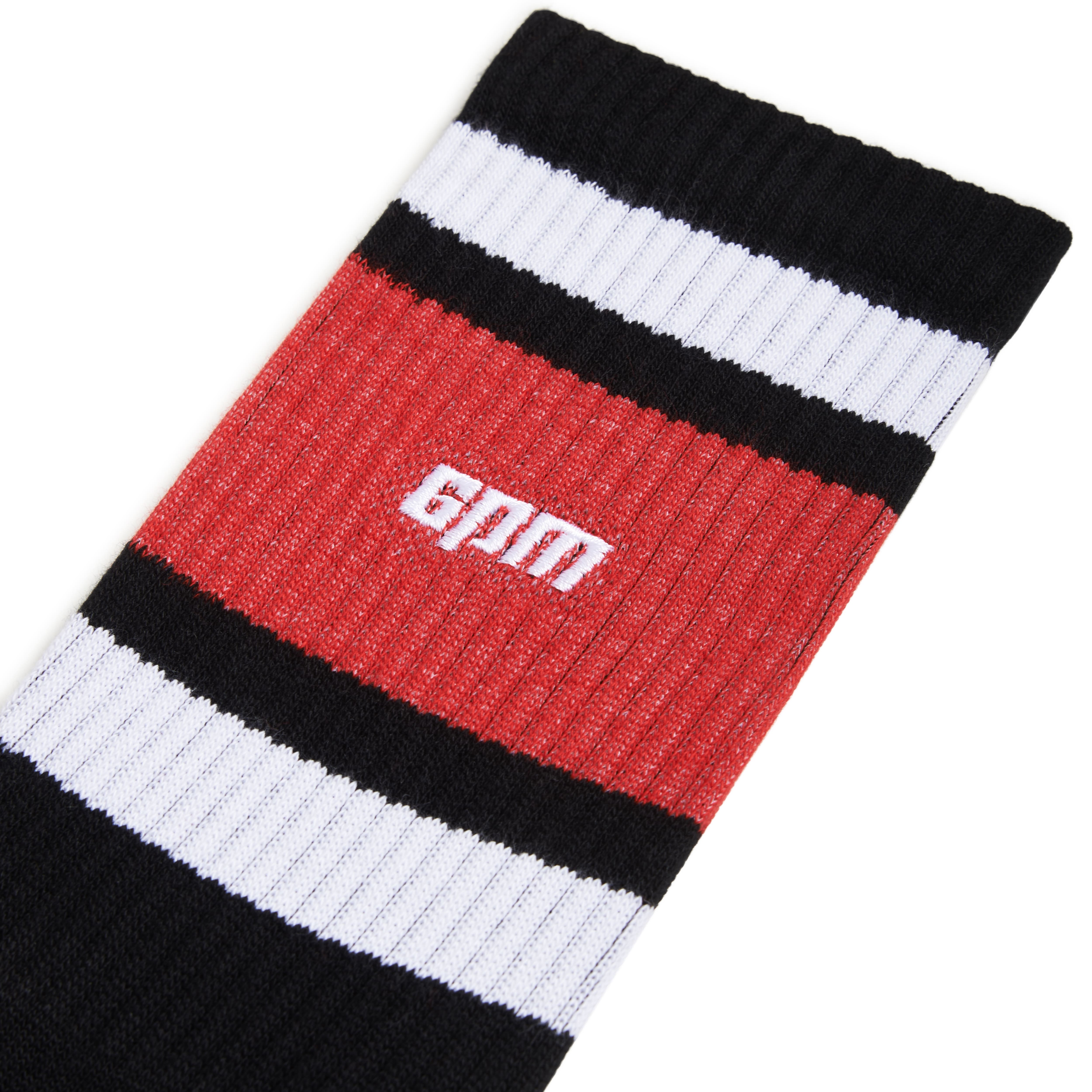 A close-up of 6PMs LOGO TUBE SOCKS BLACK, showcasing horizontal black, red, and white stripes with gym in white text on the red stripe.