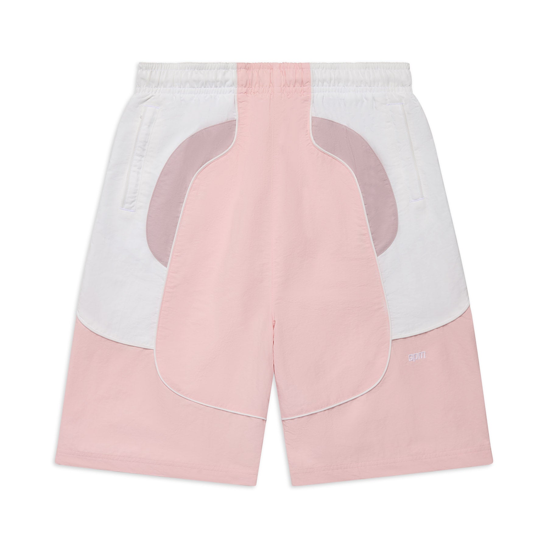 The 6PM BAGGY WARM UP SHORTS PINK feature pastel pink, light purple, and white color-blocked panels, an elastic waistband, side pockets, and curved angular shapes for a modern sporty style.
