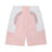 The 6PM BAGGY WARM UP SHORTS PINK feature pastel pink, light purple, and white color-blocked panels, an elastic waistband, side pockets, and curved angular shapes for a modern sporty style.
