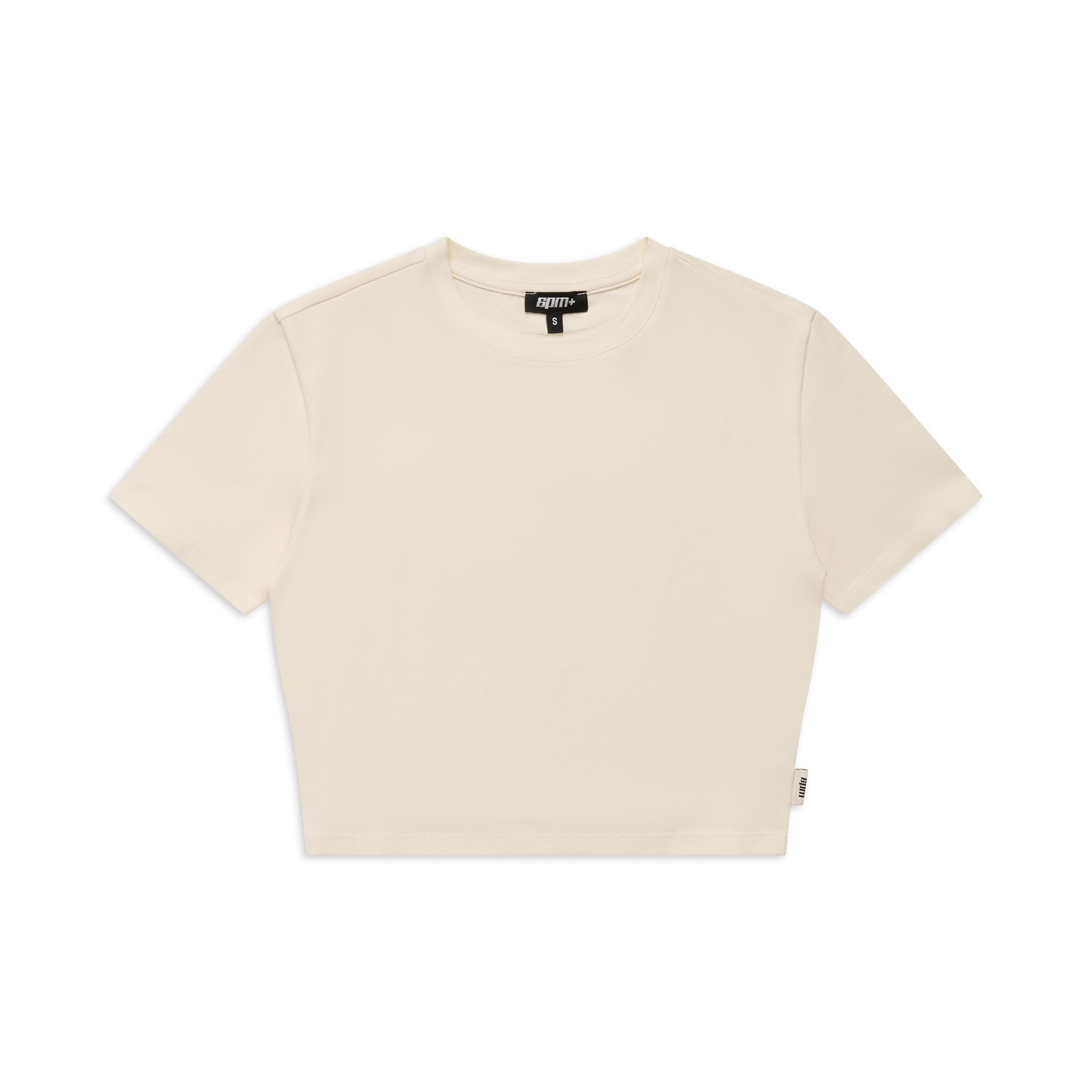 The 6PM WMNS CROPPED T-SHIRT OFF-WHITE is a plain, short-sleeved cropped tee in off-white, shown flat on a white background with a small fabric tag on the left and a black neck label.