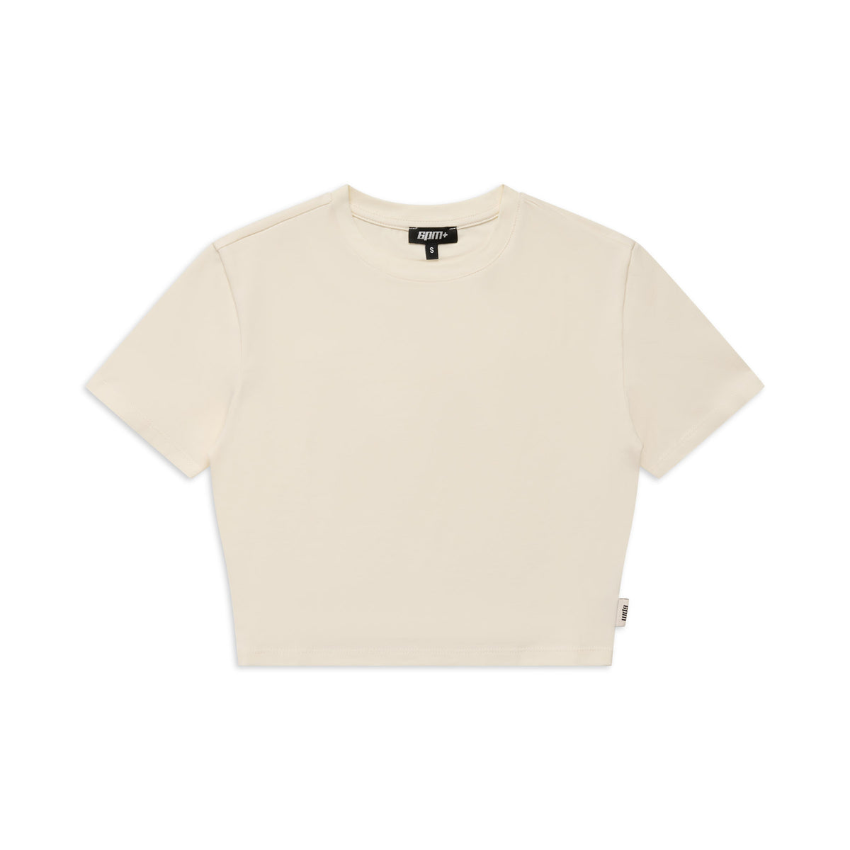 The 6PM WMNS CROPPED T-SHIRT OFF-WHITE is a plain, short-sleeved cropped tee in off-white, shown flat on a white background with a small fabric tag on the left and a black neck label.
