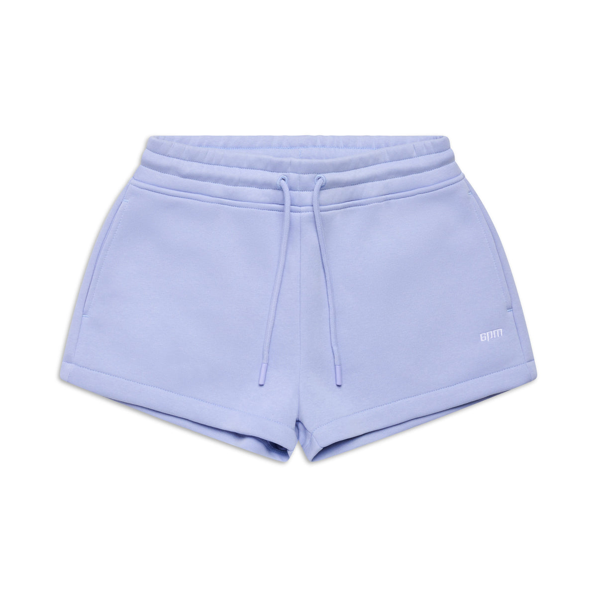 The 6PM WMNS SHORTS SOFT VIOLET feature an elastic waistband, drawstring ties, and side pockets. Displayed on a white background, these light purple shorts have a simple casual design with a small logo on the left leg.
