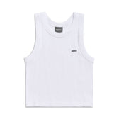 The CROP TOP WHITE (SINGLE) by 6PM is a sleeveless ribbed cotton tank with a round neckline, black 6PM logo on the left chest, and an inner collar label. Stretch fit is shown flat against a white background.