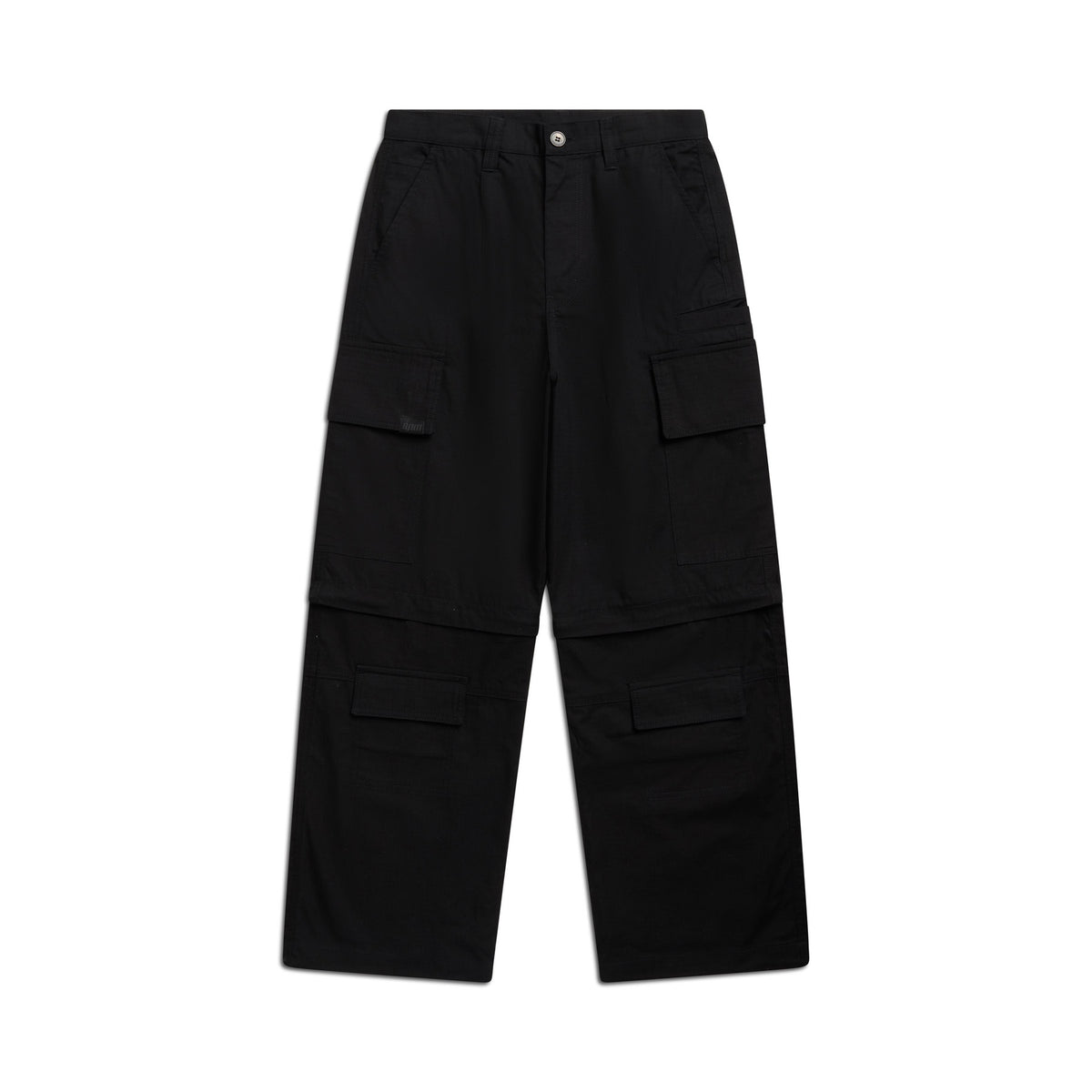 The 6PM ZIP-OFF CARGO BLACK pants feature a straight-leg fit, multiple flap pockets on the thighs and knees, belt loops at the waistband, and a button closure. Shown laid flat on a white background.