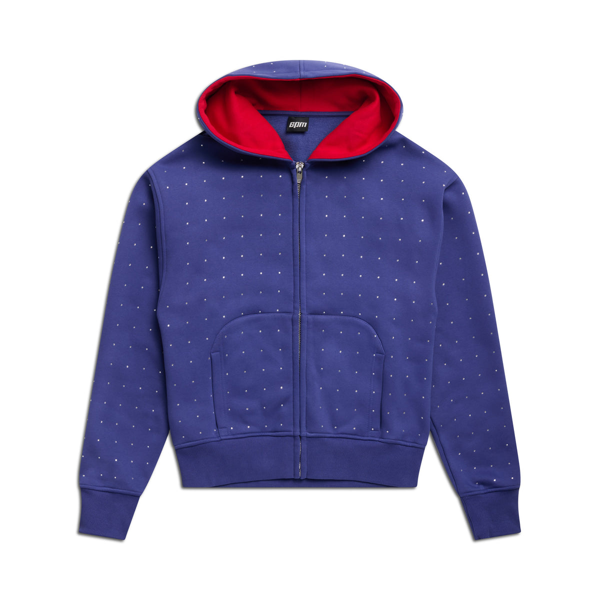 The 6PM RHINESTONE LETTER ZIP HOODIE BLUE features front pockets and a red-lined hood, with small white dots, shown on a white background.