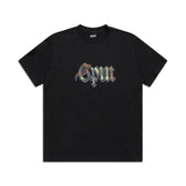 The 6PM OLD ENGLISH CAMO TEE BLACK is a black short-sleeve crew neck t-shirt featuring gpm in a multicolored gothic font across the chest, with no other visible patterns or graphics.