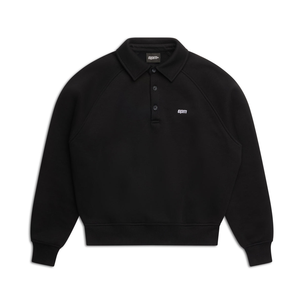 The WMNS POLO BLACK by 6PM is a black long-sleeve polo sweatshirt with a collar, three buttons, ribbed cuffs and hem, and small white 6PM text on the left chest. Displayed on a white background.