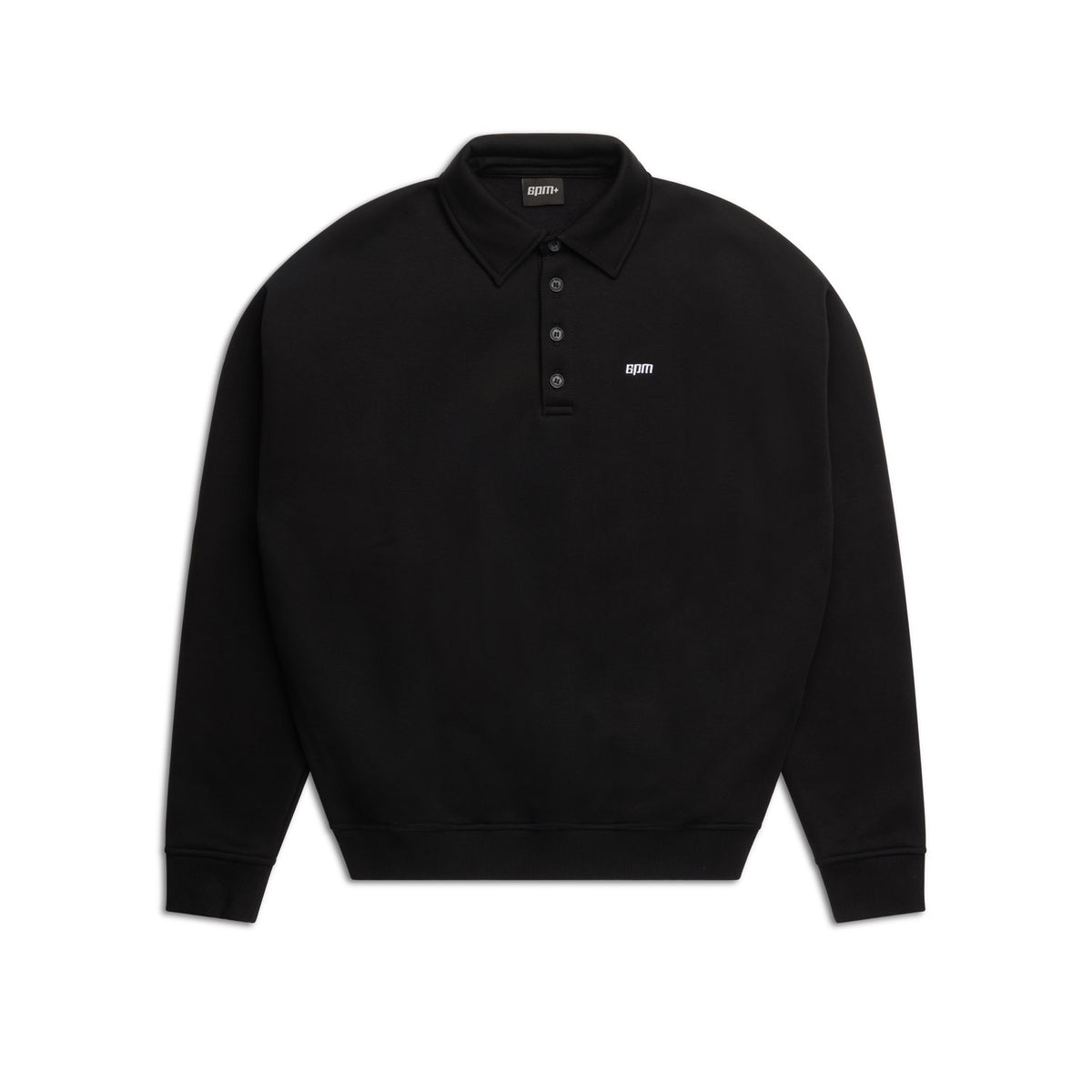 The 6PM POLO BLACK is a plain black long-sleeve polo shirt with a collar, three buttons, ribbed cuffs, and a small white logo on the left chest, shown against a white background.