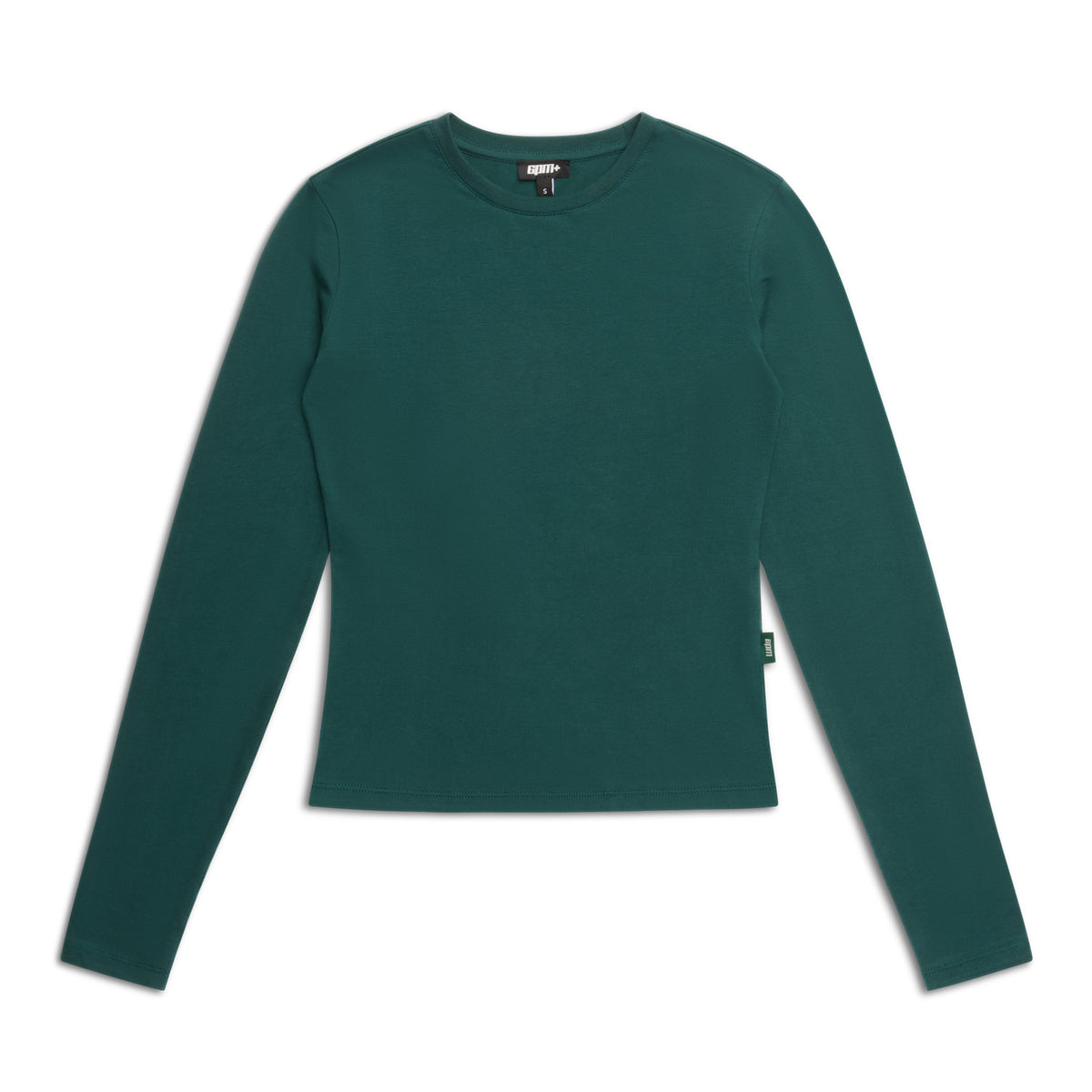 The 6PM WMNS LONGSLEEVE EVERGREEN is a fitted, forest green women’s crew neck shirt with long sleeves, shown laid flat on a white background and featuring a small tag on the left side seam.
