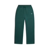 The 6PM WMNS OPEN LEG EVERGREEN sweatpants feature a dark green, straight-leg design with an elastic waistband, drawstring, side pockets, and a small white logo on the left thigh. Pants are shown laid flat on a white background.