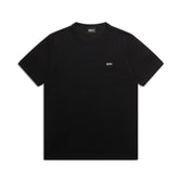The RIBBED SLIM FIT TEE BLACK by 6PM is a plain black slim-fit short-sleeve t-shirt with a small white logo on the left chest, shown on a white background.