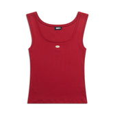 The 6PM WMNS TANKTOP CRANBERRY RED is a sleeveless top featuring a scoop neckline and a small oval metallic accent below the collar, shown laid flat on a white background.
