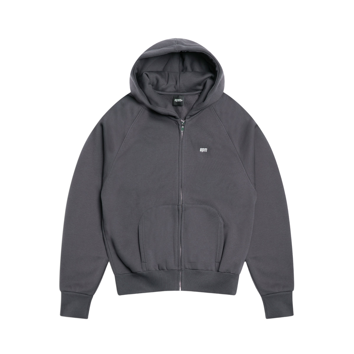 The 6PM ZIP HOODIE ANTHRACITE is a dark gray zip-up hoodie with a hood, front pockets, and a subtle white logo on the left chest, shown laid flat on a white background for a polished appearance.