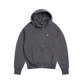 The 6PM ZIP HOODIE ANTHRACITE is a dark gray zip-up hoodie with a hood, front pockets, and a subtle white logo on the left chest, shown laid flat on a white background for a polished appearance.