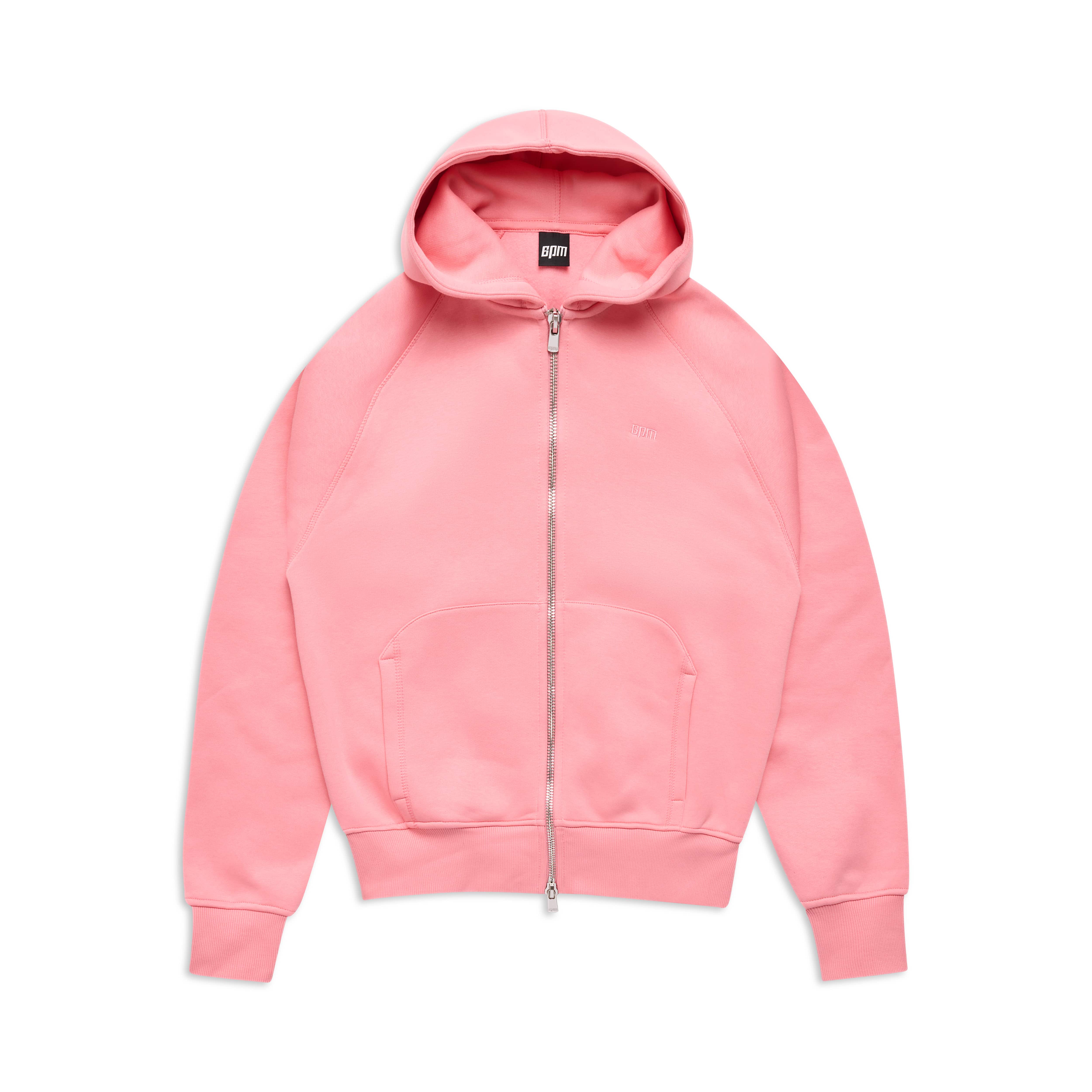 The 6PM COVERLOCK ZIP HOODIE FLAMINGO PINK features a light pink shade, front zip, pocket, drawstring hood, and ribbed cuffs and hem, displayed laid flat on a white background.